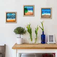 Load image into Gallery viewer, Palm Tree Beach, a painting by Aria Luna, framed and displayed in a small home office